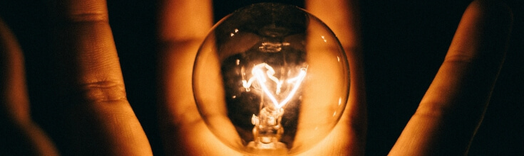 Light Bulb in Opened Hand