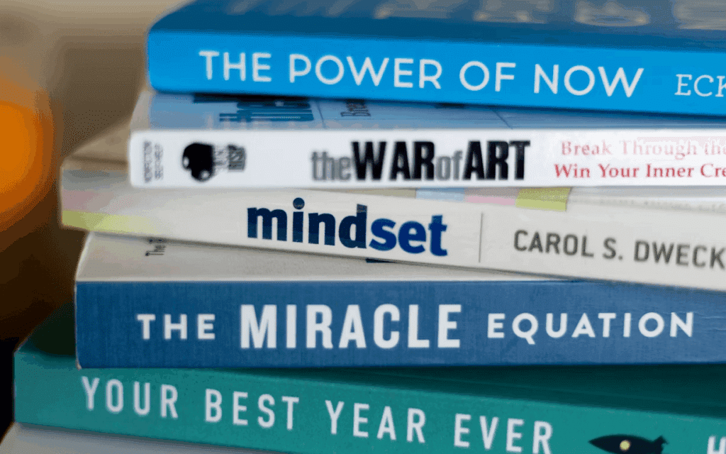Stack of books on table about personality and health