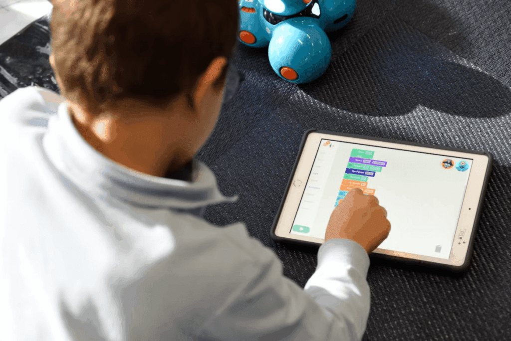 Young boy using a tablet for personalized learning